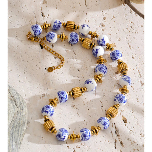 Blue flower beaded necklace in gold-plated stainless steel.
