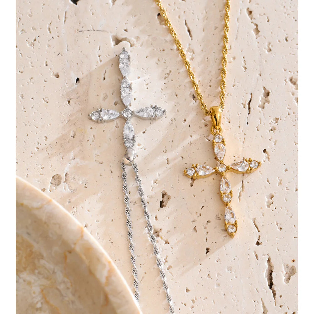 Cubic zirconia cross necklace in gold-plated stainless steel with cubic zirconia.