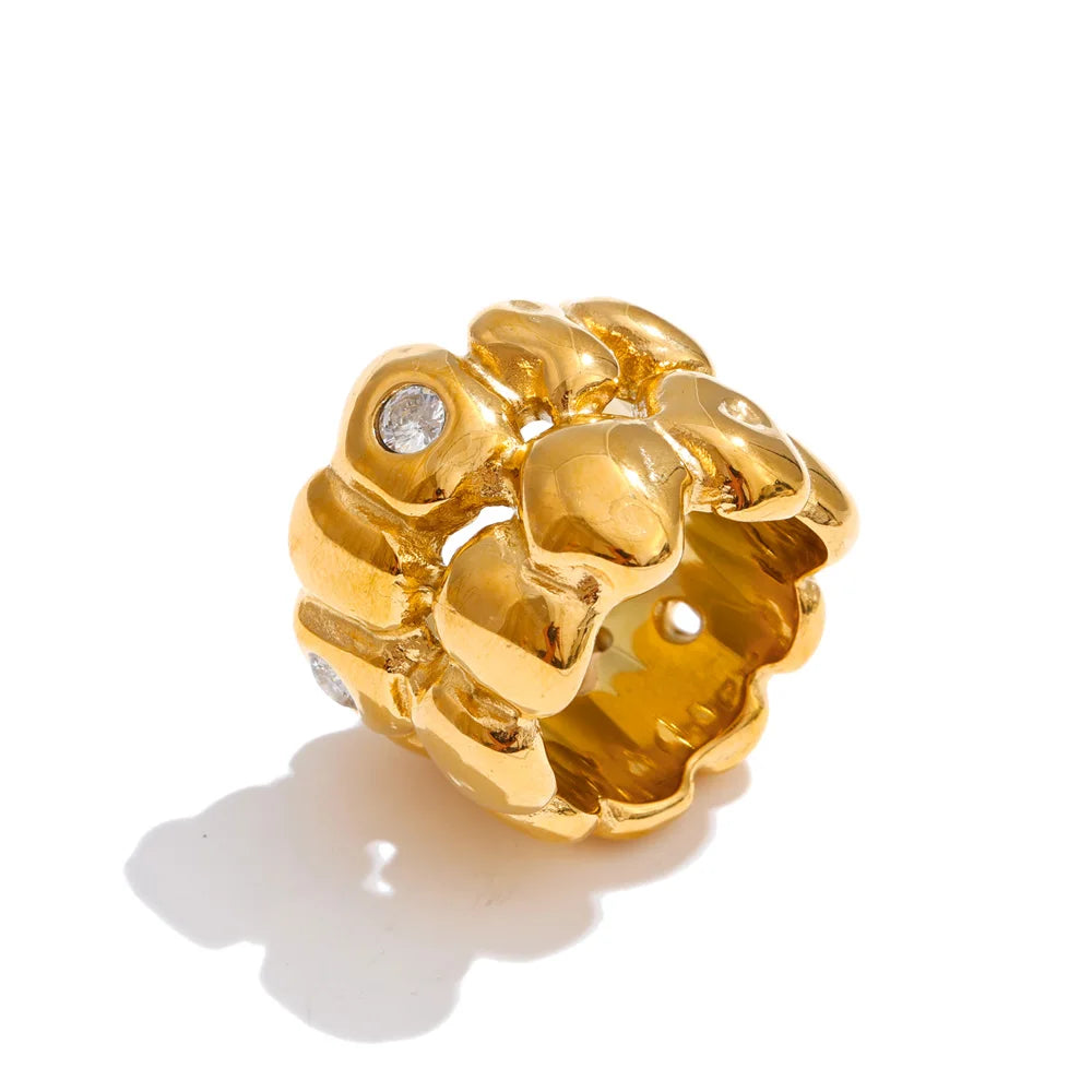Cubic zirconia geometric ring in 18K gold-plated stainless steel with cubic zirconia.