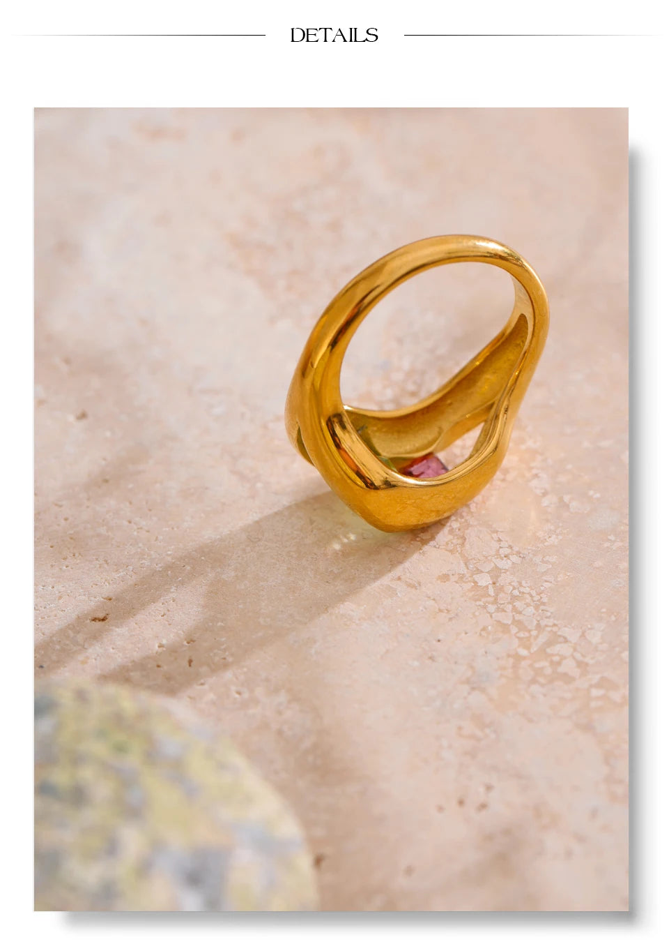 Cubic zirconia geometric ring in 18K gold-plated stainless steel with cubic zirconia.