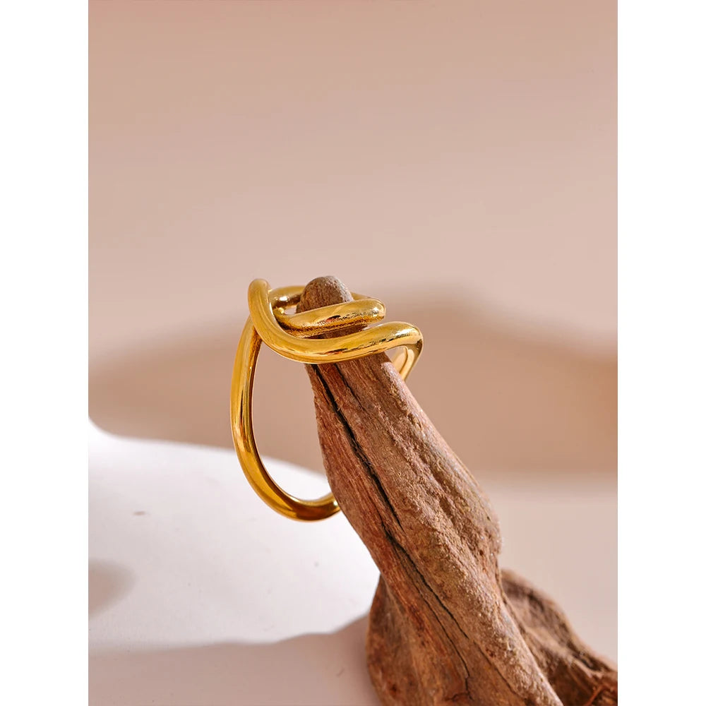 Geometric ring in 18K gold-plated 316L stainless steel.