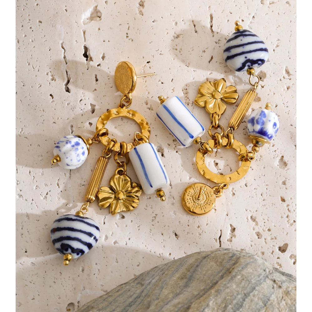 Blue heart flower earrings in gold-plated stainless steel.