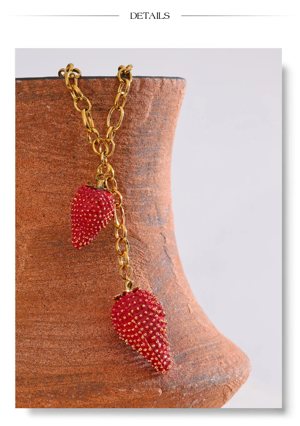 Red heart geometric necklace in gold-plated stainless steel.