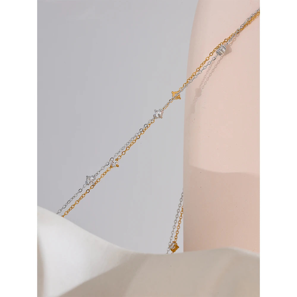 Cubic zirconia geometric necklace in gold-plated stainless steel with cubic zirconia.