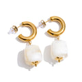 Resin acrylic geometric earrings in gold-plated stainless steel with resin and acrylic.