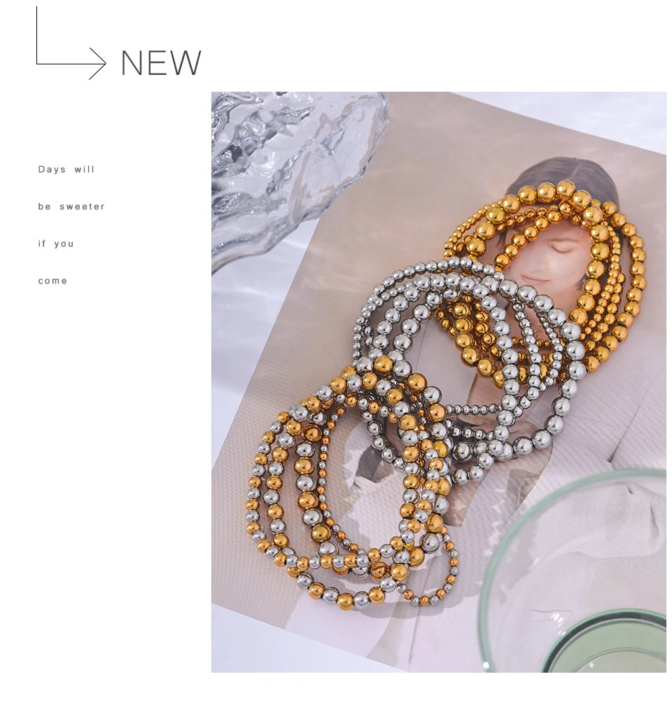 Beaded geometric bracelet in gold-plated stainless steel.