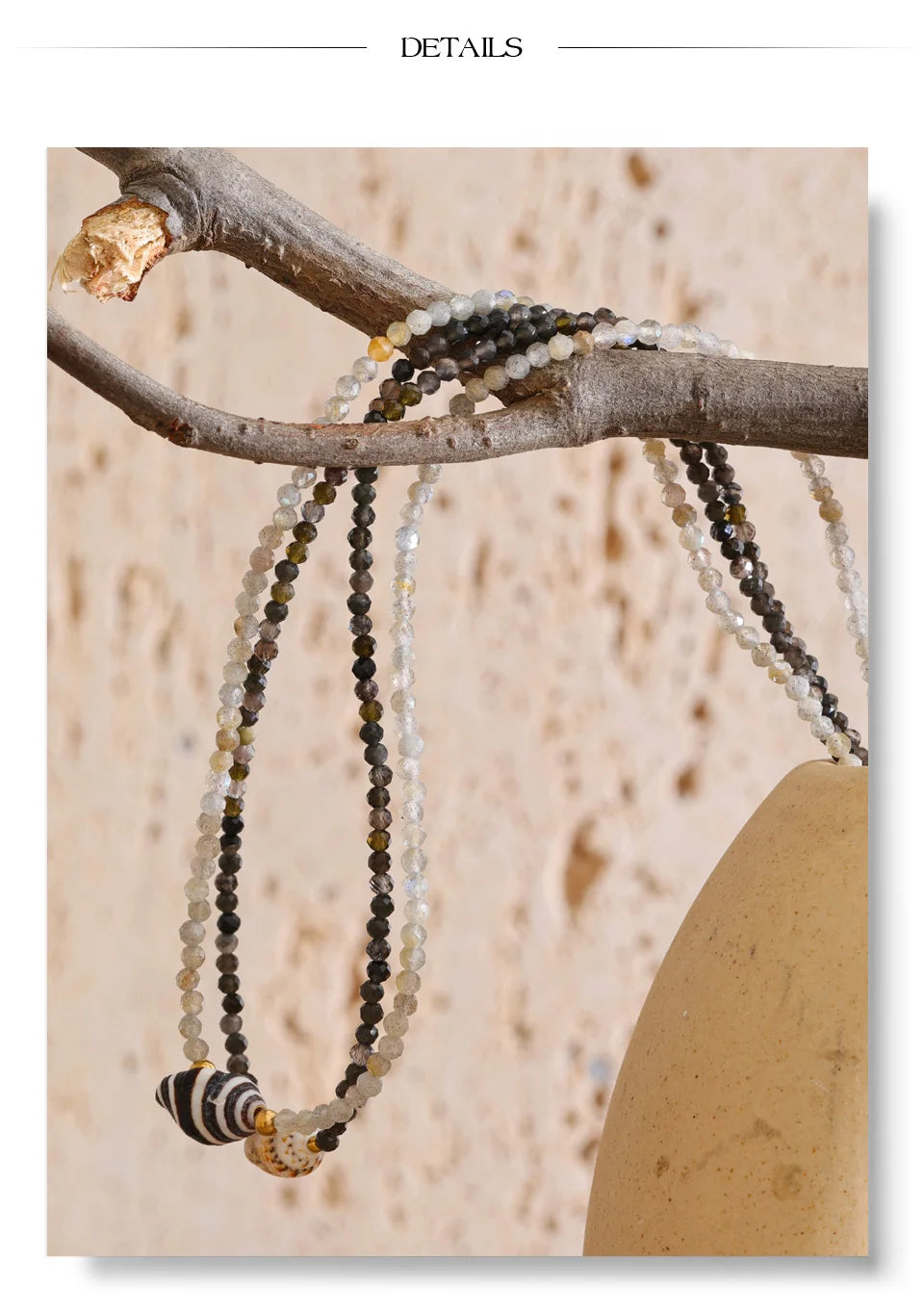 Crystal geometric necklace in gold-plated stainless steel with crystal.