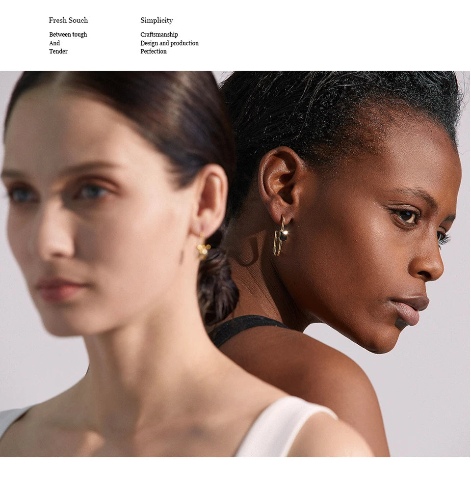 Black cubic zirconia geometric earrings in 18K gold-plated stainless steel with cubic zirconia.