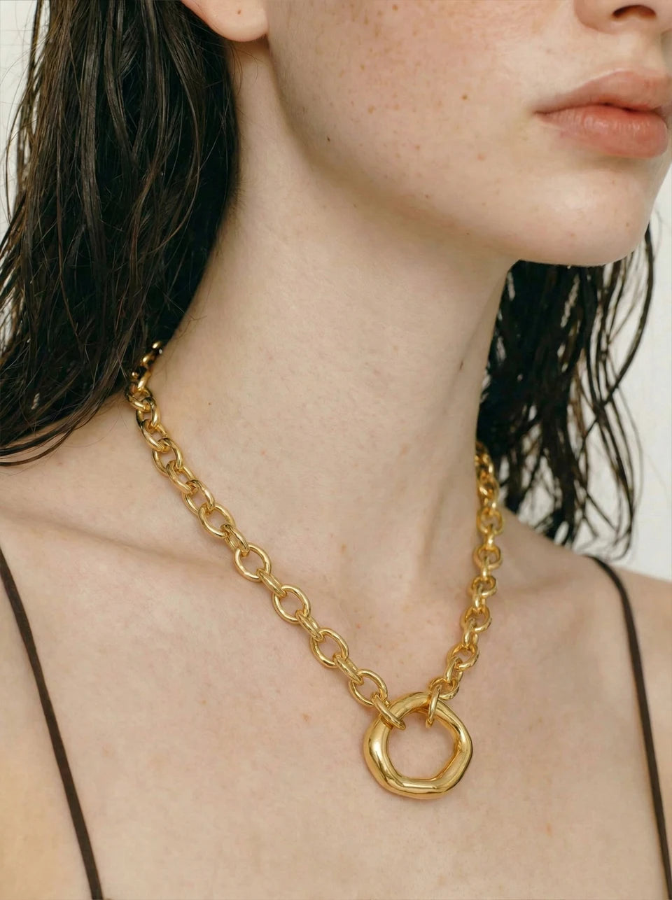 Coin geometric necklace in gold-plated stainless steel.