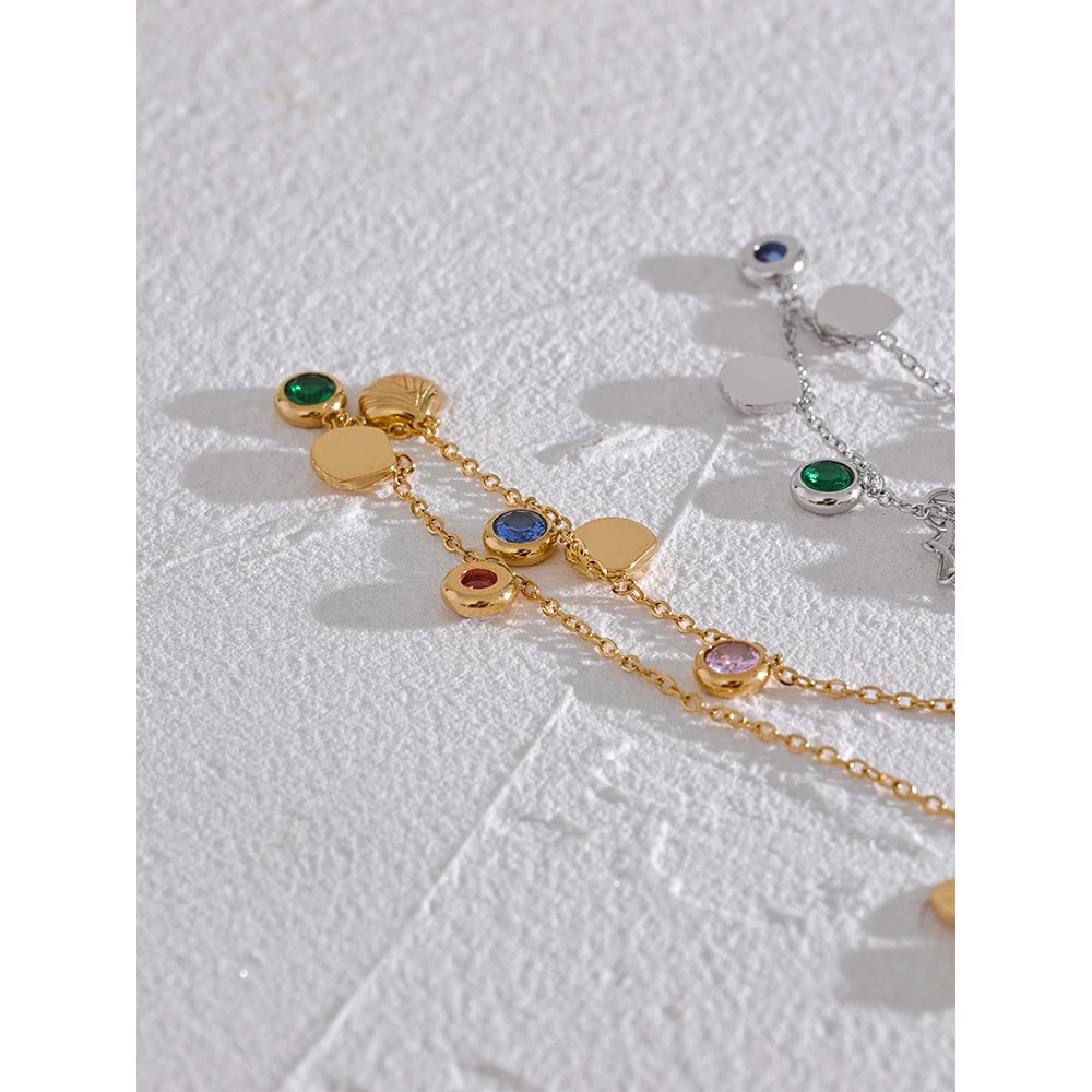 Cubic zirconia shell multi-color anklet in gold-plated stainless steel with cubic zirconia and shell.