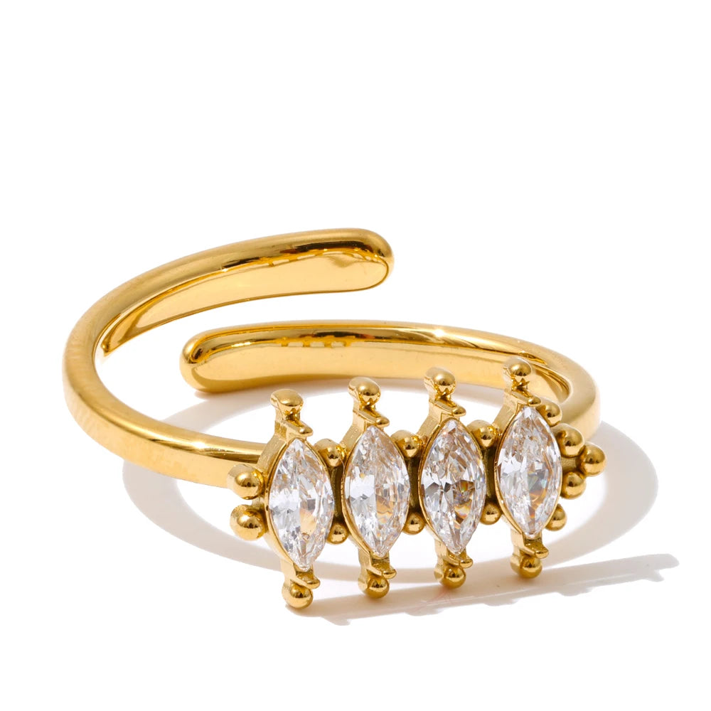 Cubic zirconia geometric ring in 18K gold-plated stainless steel with cubic zirconia.
