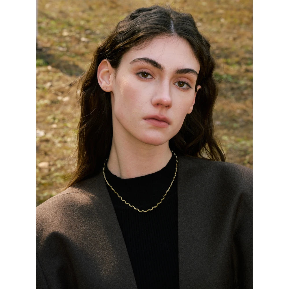 Geometric chain necklace in gold-plated stainless steel.