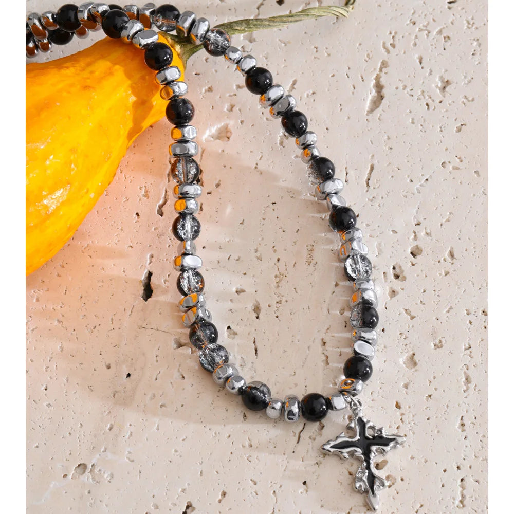 Natural stone cross beaded necklace in gold-plated stainless steel with natural stone.