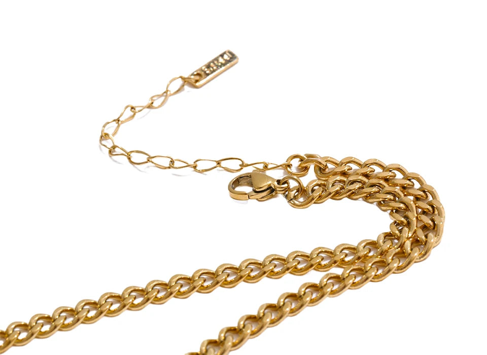 Cubic zirconia geometric chain necklace in gold-plated stainless steel with cubic zirconia.