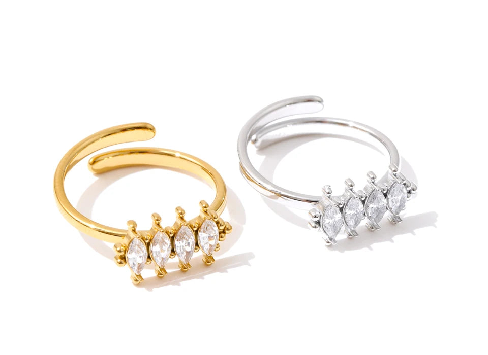 Cubic zirconia geometric ring in 18K gold-plated stainless steel with cubic zirconia.