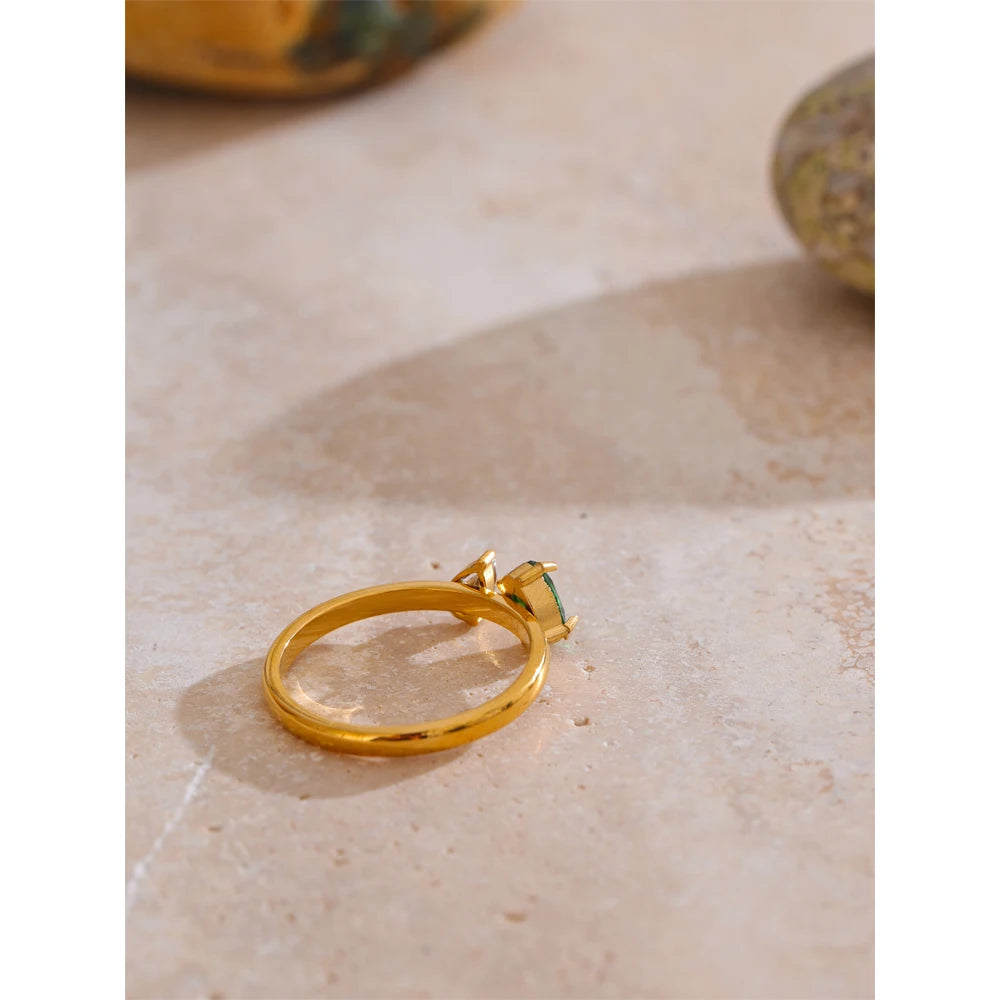Cubic zirconia geometric ring in 18K gold-plated stainless steel with cubic zirconia.