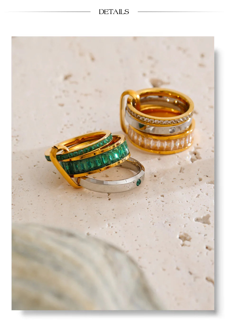 Cubic zirconia geometric layered ring in 18K gold-plated stainless steel with cubic zirconia.