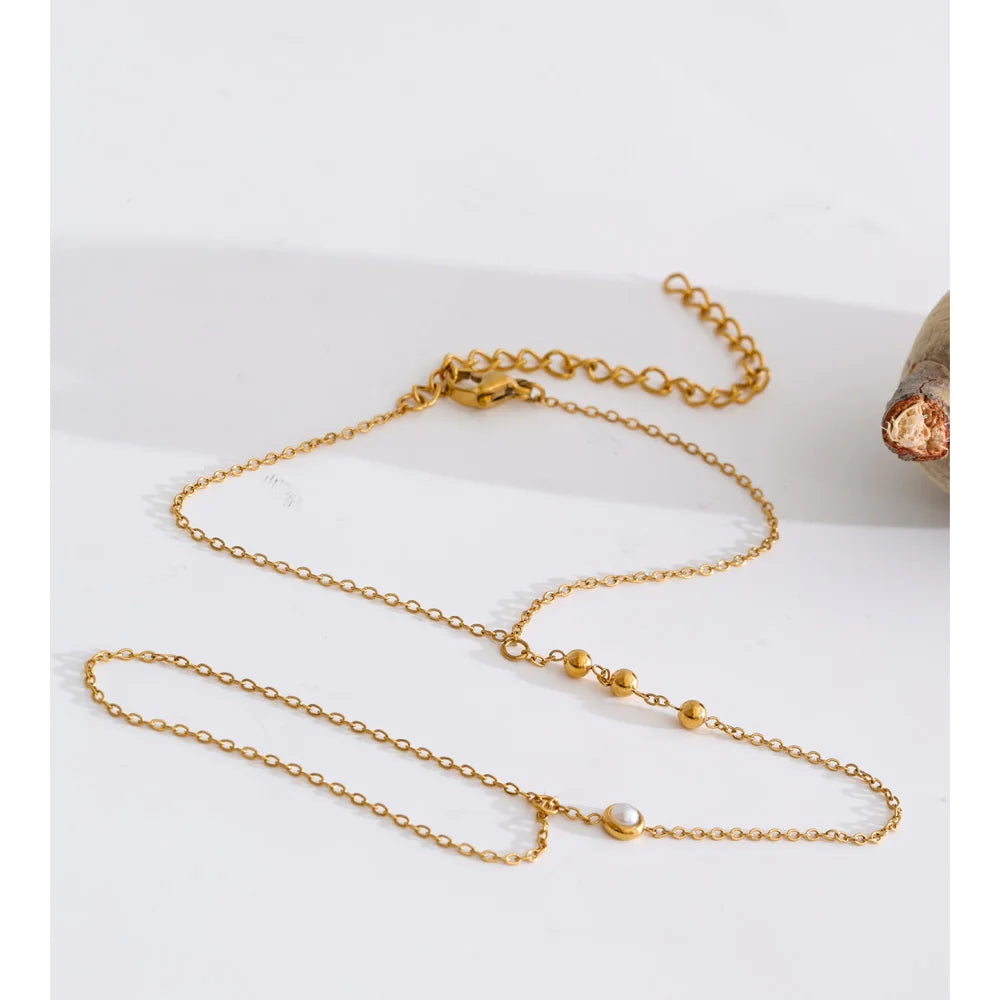 Cubic Zirconia Pearl Geometric Bracelet — Gold-Plated Stainless Steel with Pearl and Cubic Zirconia · PS1349
