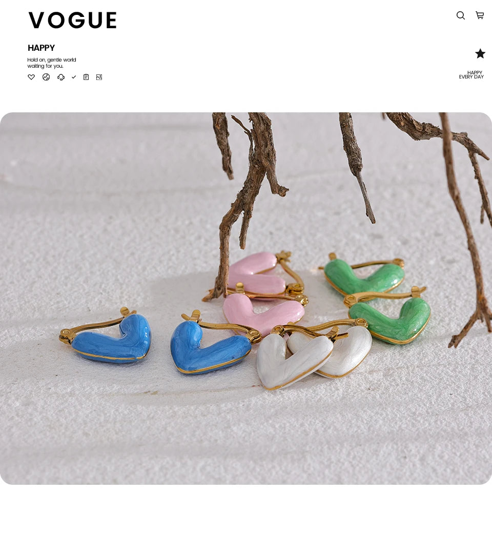 White enamel heart earrings in gold-plated stainless steel with enamel.