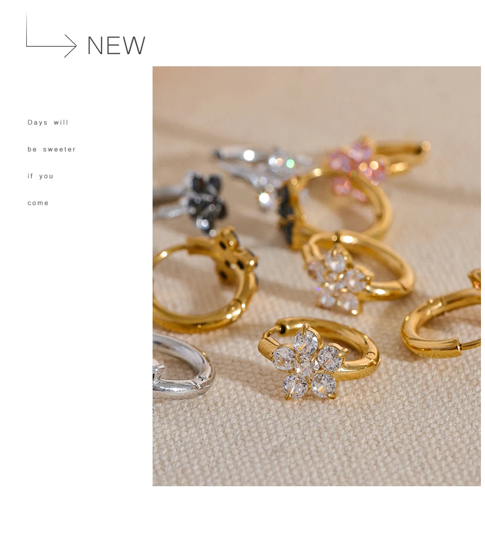 Cubic zirconia flower earrings in gold-plated stainless steel with cubic zirconia.