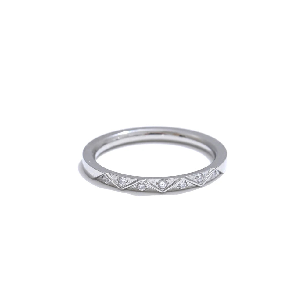 Cubic zirconia geometric ring in gold-plated stainless steel with cubic zirconia.