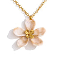 Resin acrylic flower necklace in gold-plated stainless steel with resin and acrylic.
