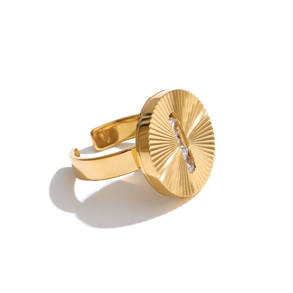 Cubic zirconia geometric ring in 18K gold-plated stainless steel with cubic zirconia.