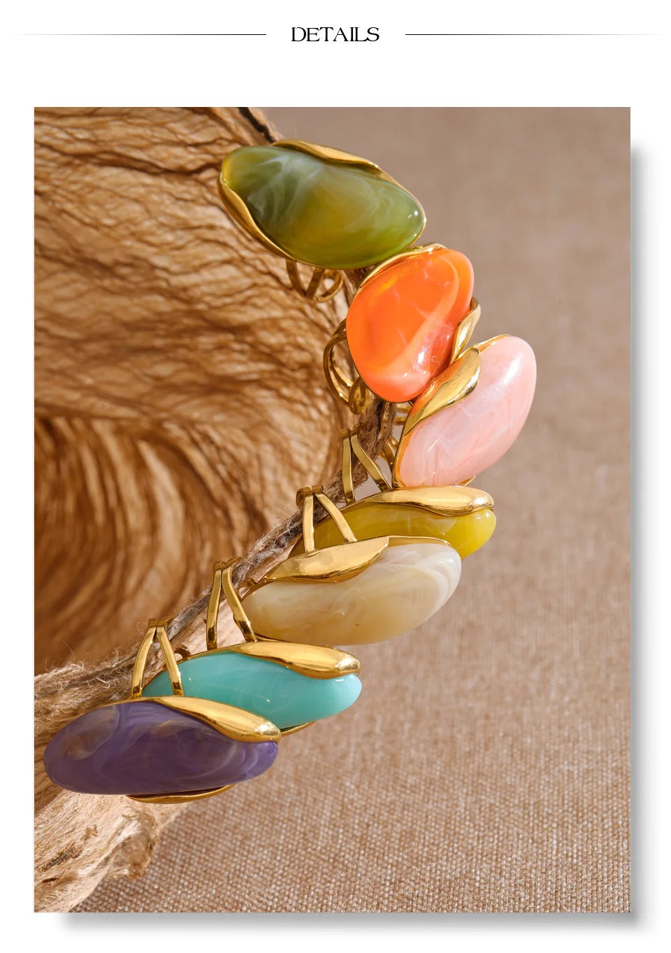 Resin multi-color geometric ring in 18K gold-plated stainless steel with resin.