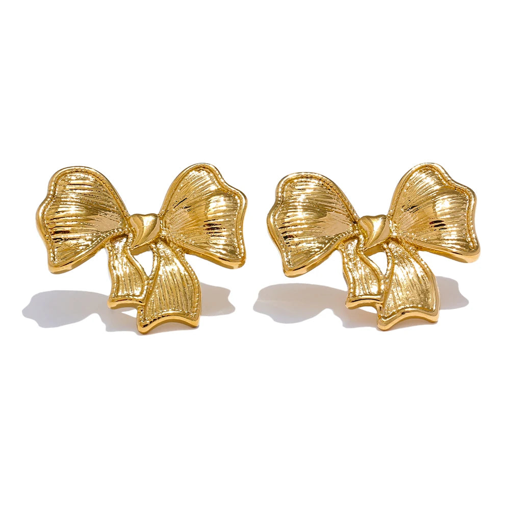 Bow earrings in gold-plated stainless steel.