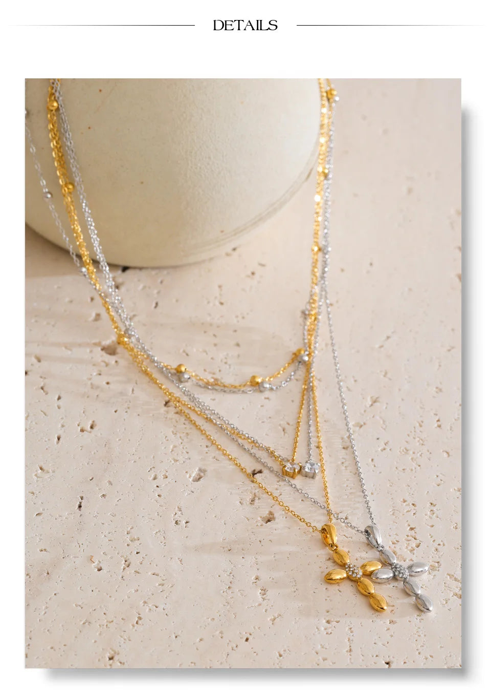 Cubic zirconia cross chain necklace in gold-plated stainless steel with cubic zirconia.