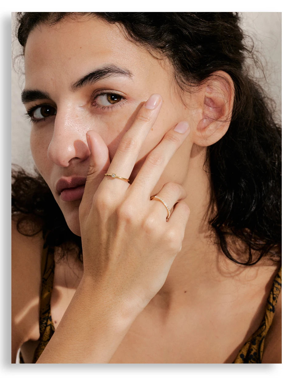 Cubic zirconia geometric ring in 18K gold-plated stainless steel with cubic zirconia.