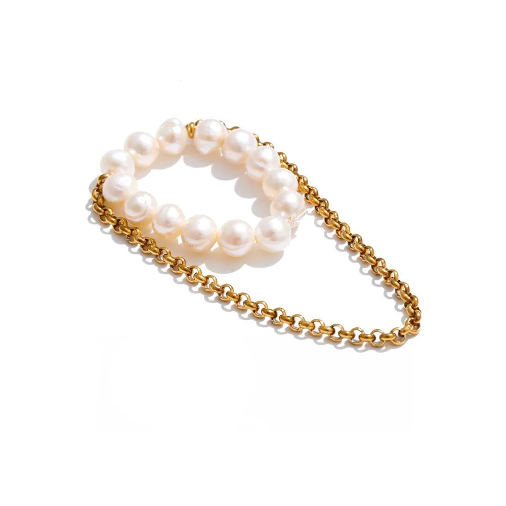 Gold-plated ring with pearls.