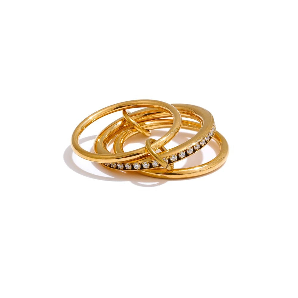 Gold-plated stainless steel ring with cubic zirconia stones.