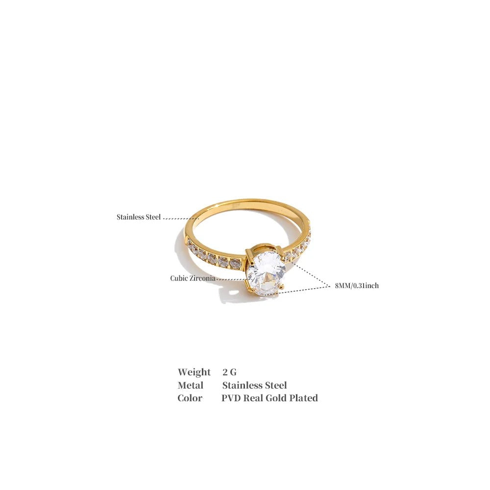 Cubic zirconia geometric ring in 18K gold-plated stainless steel with cubic zirconia.