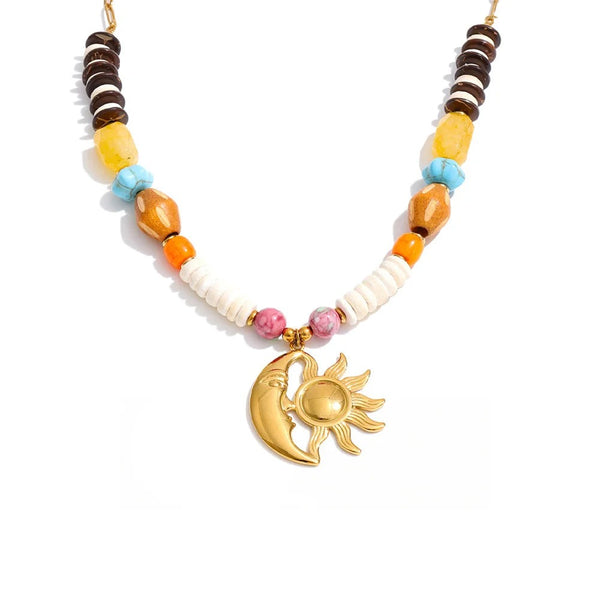 Gold-plated necklace with natural stone and resin beads featuring a moon and star pendant.