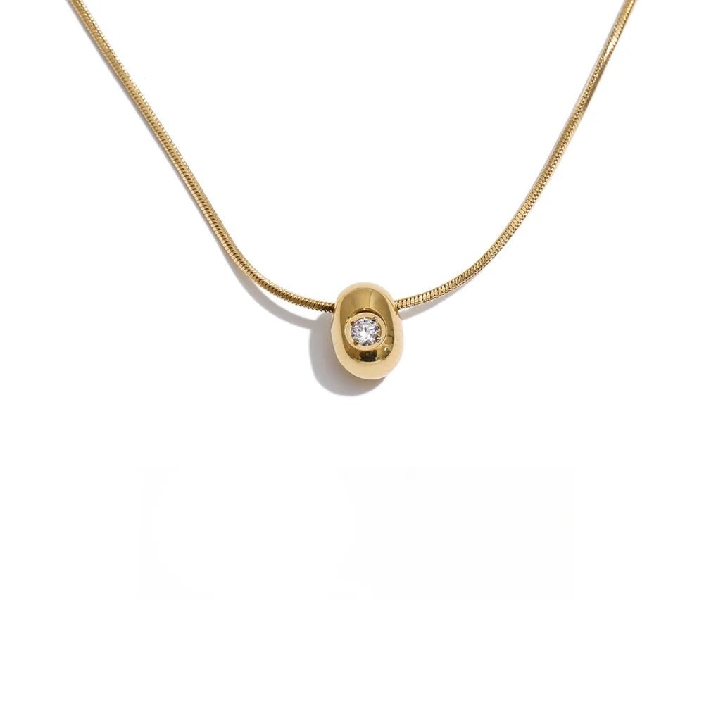 Gold-plated stainless steel necklace with cubic zirconia pendant.