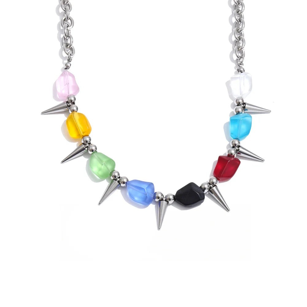 Necklace made of gold-plated stainless steel with natural stone and acrylic spikes.