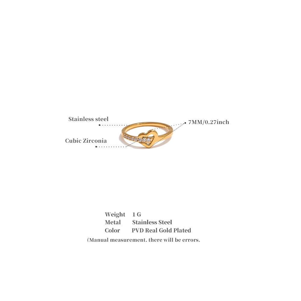 Cubic zirconia heart cross ring in 18K gold-plated stainless steel with cubic zirconia.