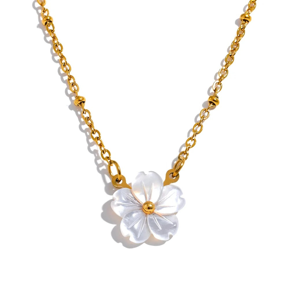 Gold-plated stainless steel necklace with a white flower pendant.