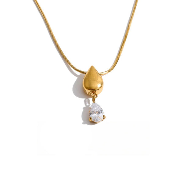 Gold-plated stainless steel necklace with cubic zirconia and a small crystal pendant.