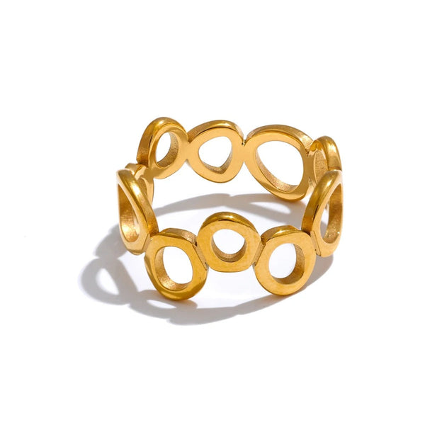 Gold-plated stainless steel ring with circular design.
