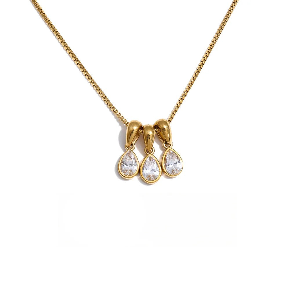 Gold-plated stainless steel necklace with cubic zirconia teardrop charms.