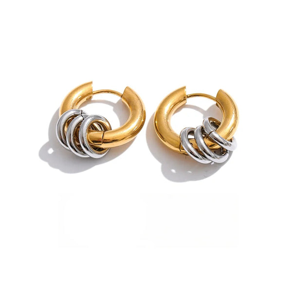 Gold-plated stainless steel earrings with a circular design.