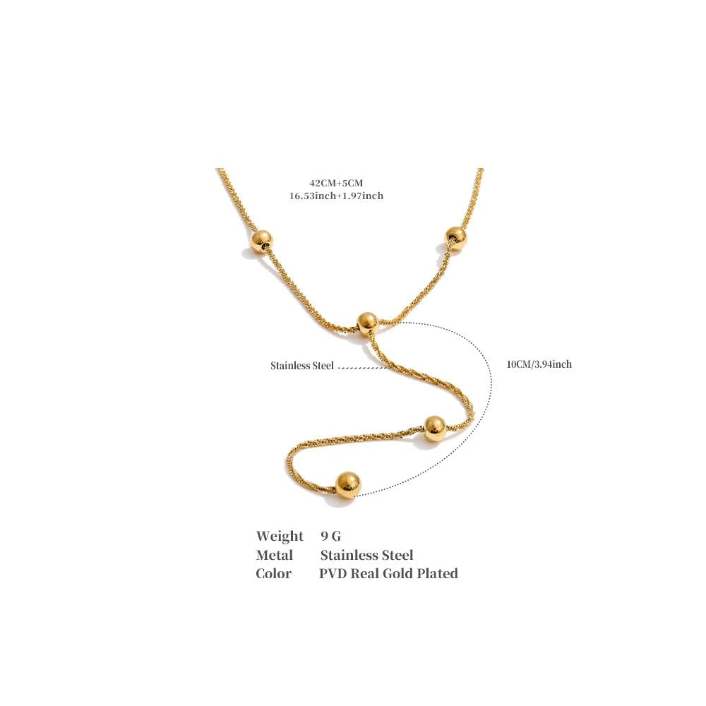 Beaded geometric chain necklace in gold-plated stainless steel.