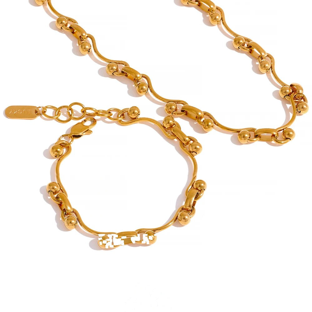 Gold-plated stainless steel necklace with a clasp.