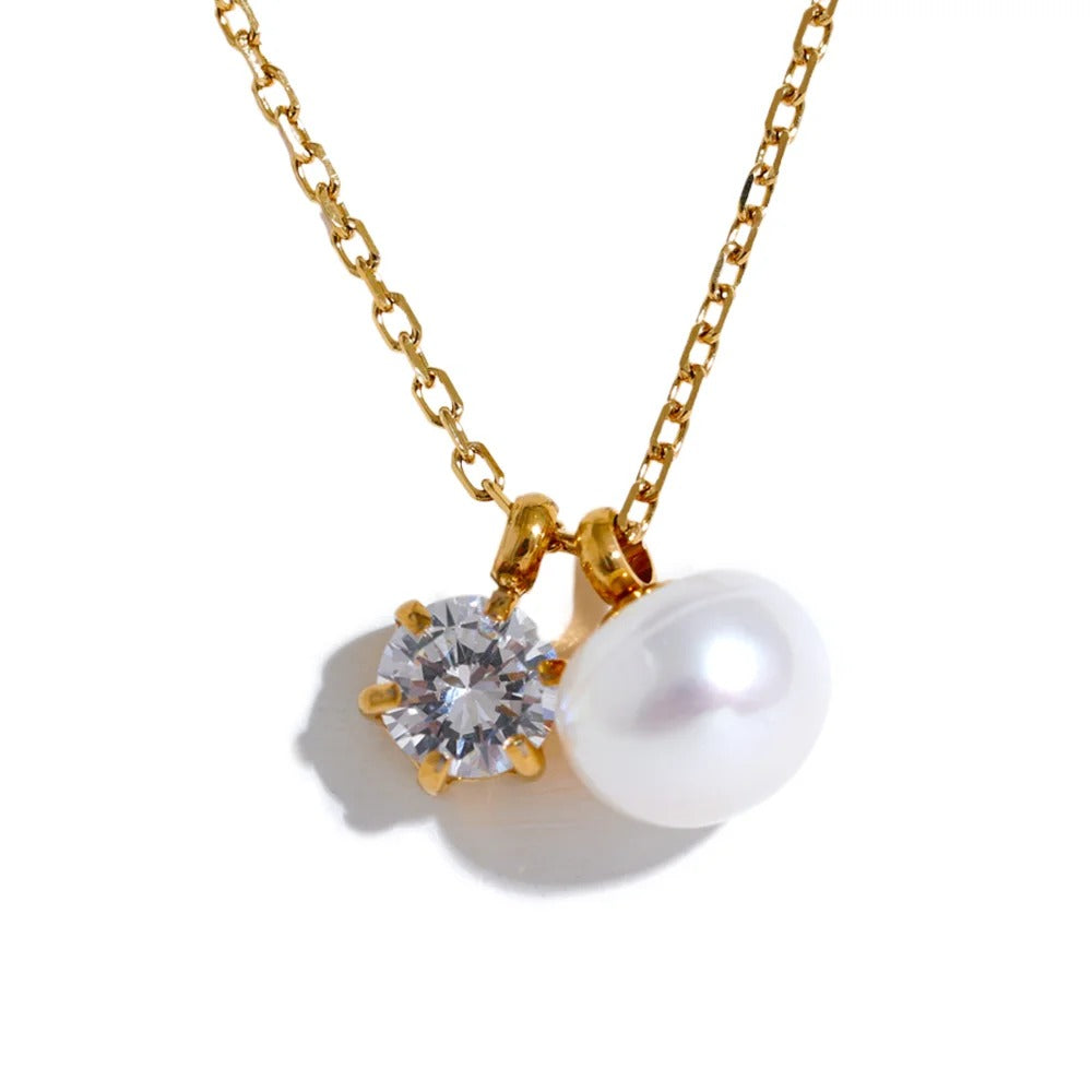 Gold-plated stainless steel necklace with pearl and cubic zirconia.