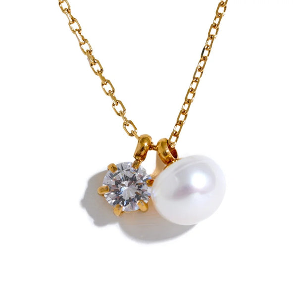 Gold-plated stainless steel necklace with pearl and cubic zirconia.