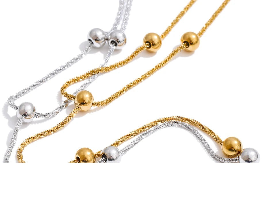 Beaded geometric chain necklace in gold-plated stainless steel.