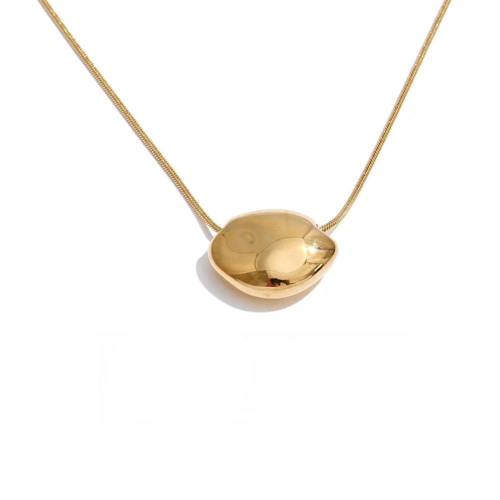 Gold-plated stainless steel necklace with a large, round pendant.
