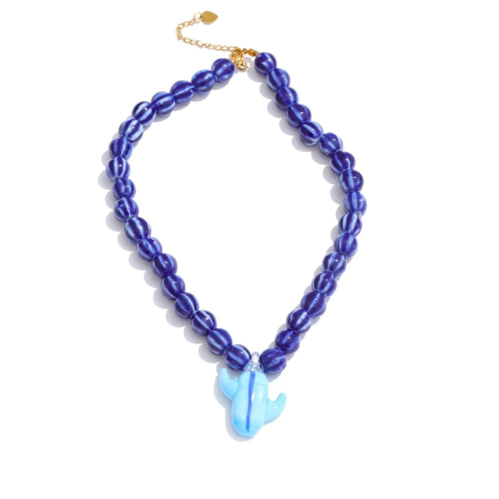 Gold-plated stainless steel necklace with blue beads and a fish charm.